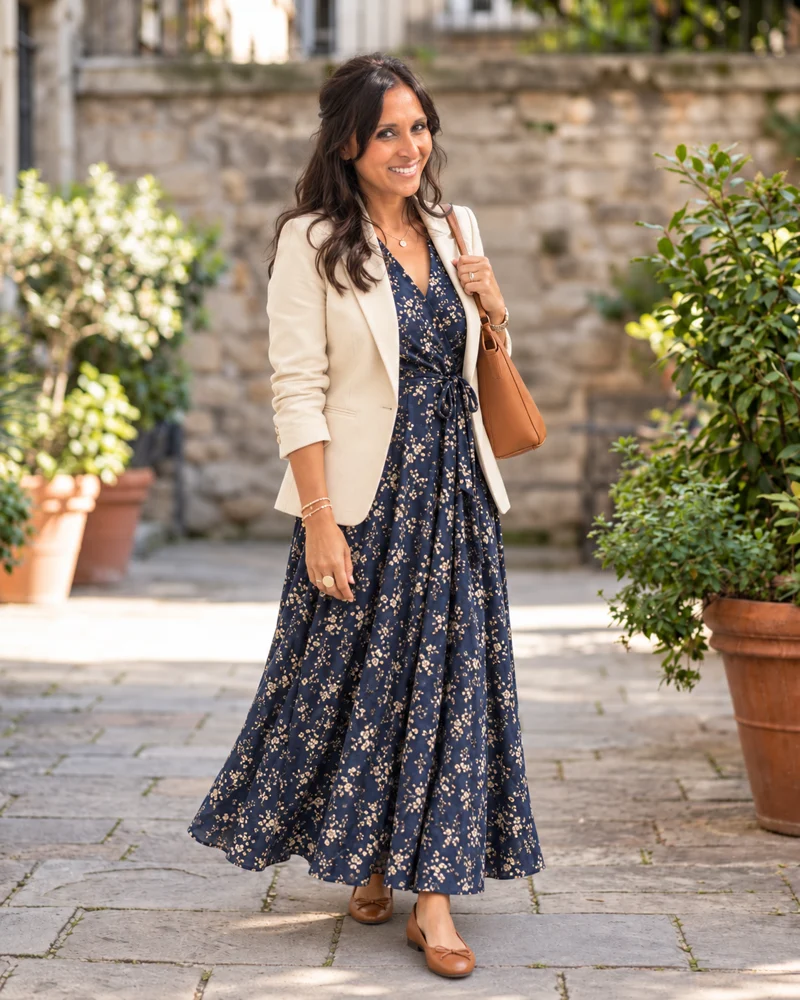 AI-generated preview of Melissa in a navy floral maxi dress, cream blazer and tan flats